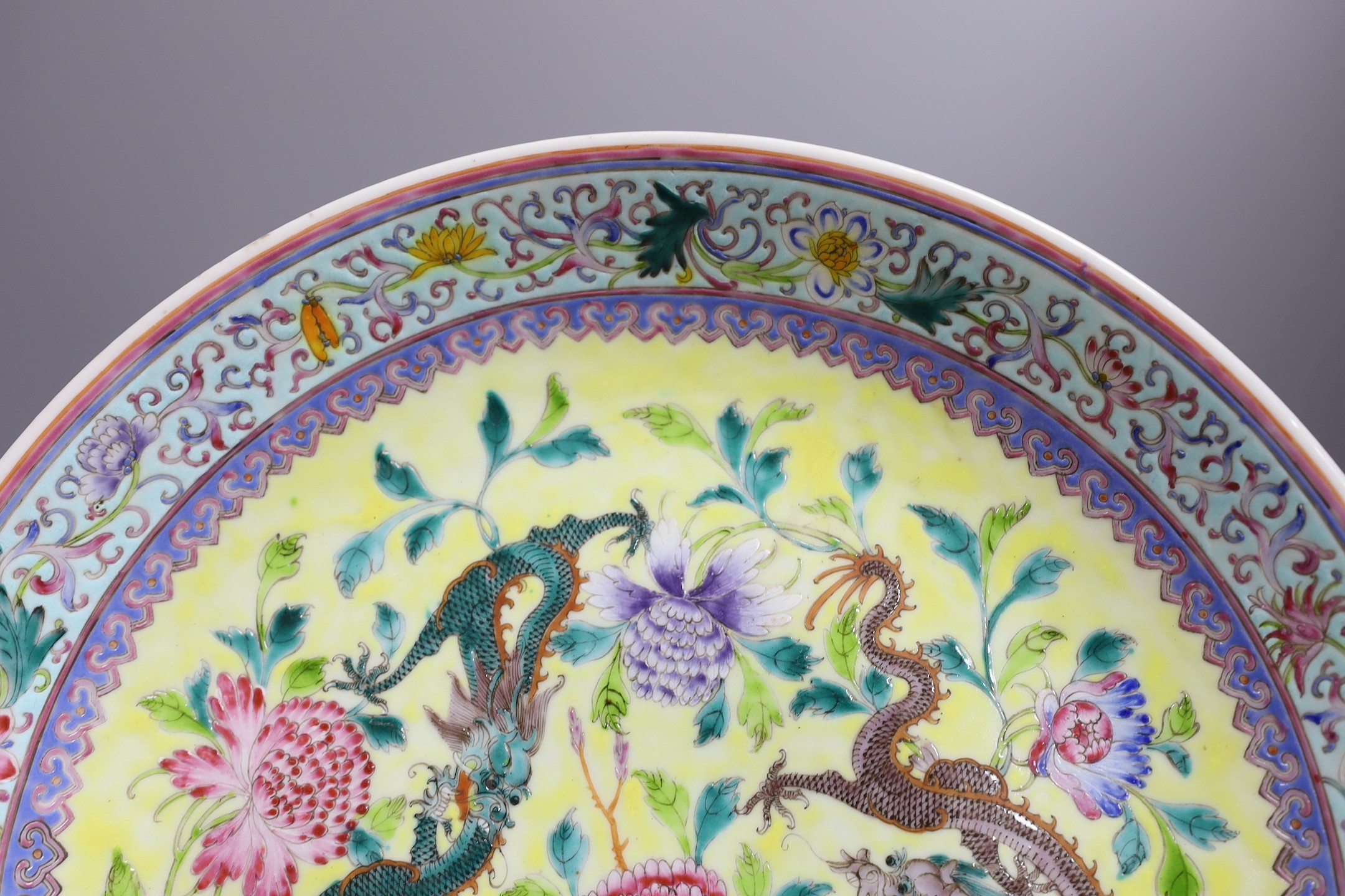 A Chinese yellow ground ‘dragon’ dish, Qianlong mark but Republic period, 34 cms diameter.